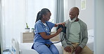 Senior care, nurse and black man with blood pressure test for healthcare, checkup or exam on bed. Hypertension, advice and mature person with caregiver with consultation, medical assessment or help.