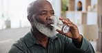Senior man, drinking water and hydration on morning for health or wellness, thirsty and care in detox. Black elderly person, relax and glass of nutrition in retirement, refreshing and happy at home
