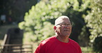 Health, fitness and senior man in a park for running, training or morning cardio outdoor. Energy, wellness or happy elderly male runner in nature for body workout, exercise or sports performance