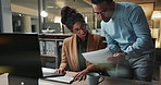 Computer, teamwork and documents with business people in office together for report or information. Collaboration, paper or development with man and woman in workplace at night for company strategy