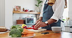 Cooking, hands and man with healthy food for meal prep, nutrition and cutting fresh ingredients for lunch. Diet, vegetables and home chef at kitchen counter with knife, recipe and salad for dinner.