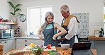 Cooking, help and mature couple with apron for meal prep, nutrition and happy marriage together in kitchen. Diet, senior man and woman with healthy food recipe, support and salad for dinner in home.