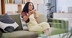 Woman, Chinese food and takeaway with chopsticks on sofa for relax dinner, nutrition or hungry. Female person, stir fry and couch or eating noodles for lunch meal or apartment, vacation or take out