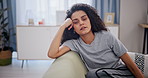 Woman, tired and depression on sofa in home with schizophrenia, mental health and burnout. Psychology, person and insomnia with anxiety, trauma and suffering on couch in living room with stress