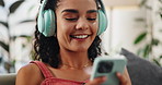 Woman, phone and headphones to relax on couch in home, streaming music and social media. Reading, ebook and person smile with happiness from internet podcast, audio or watch live stream video online