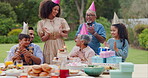 Family, clapping hands and happy with hat at birthday party for celebration, surprise or sparkler in garden of home. Grandparents, parents and kids with applause for gathering and event in backyard