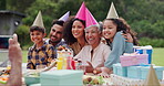 Senior, couple and happy with photography at birthday party for celebration, laughing and memories in garden. Family, people and children with smartphone, gathering and event in backyard of apartment