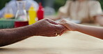 Holding hands, prayer before eating and gratitude, people worship and religion at social gathering. God, wellness and faith for trust, nutrition and spiritual with support and care at celebration