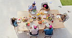 Happy family, above and birthday party in garden with love, sharing and eating to bond together for lunch. Generations, kids or celebrate by food on green backyard, nutrition and roast meat on table