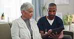 Homecare, tablet or nurse with senior woman on sofa for internet, help or checking sign up service guide for home consultation request. Digital, app and man caregiver showing patient service options