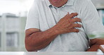 Man, hands and chest pain with heart, illness or cancer in discomfort, emergency or healthcare at hospital. Closeup of male person or patient with sore body, ache or breathing problem at clinic