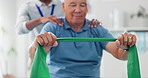 Resistance band, physical therapy and old man with physiotherapist, muscle training and strength with senior care. Health, wellness and people at physio clinic with rehabilitation and equipment