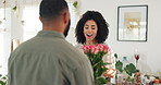 Couple, hug and flowers as surprise for valentines day with love bouquet or relationship, anniversary or behind. Man, woman and embrace in home with roses for marriage or date, celebration or present