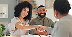 Handshake, meeting and couple with real estate agent for buying new home, house or property. Happy, deal and young man and woman shaking hands for apartment or building purchase with realtor.