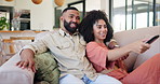 Couple, watching tv and remote on sofa for choice, click and discussion with smile to relax in home. Man, woman and chat for decision with streaming, subscription or movies on lounge couch in house