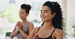 Woman, meditation and prayer hands in class for holistic wellness, exercise and mental health with a smile. People or happy friends with zen, namaste and yoga for mindfulness, calm and peace together