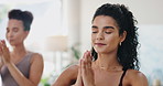 Woman, yoga and praying hands in class for holistic wellness, exercise and healing with breathing exercise. People with namaste, peace and palm together for meditation, mindfulness and mental health