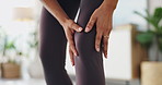 Pain, massage and woman with knee injury for fitness pilates exercise or workout in apartment. Accident, hurt and closeup of female person touching leg muscle sprain or bruise with medical emergency.