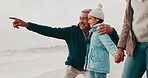 Grandfather, beach and child with point, holiday and happy for teaching in nature, bonding or holding hands. People, family and kid with senior man, hug or show direction by sea on vacation with chat