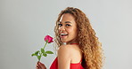 Woman, happy and rose in studio with smile for gift, kindness and gratitude with scent or fragrance on a white background. Face of excited, African person or model with pink flower for valentines day