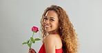 Young, woman and rose in studio with smile for gift, kindness and gratitude with scent or fragrance on a white background. Face of excited, African person or model with pink flower for valentines day