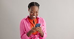 Wow, news and excited black woman with phone in studio for online competition giveaway on grey background. Yes, smartphone and happy female model with app notification of sign ups winner or prize