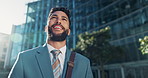 Happy, pride and young businessman in city looking at buildings for corporate office. Smile, professional and male financial advisor standing in town with positive, proud and confident attitude.