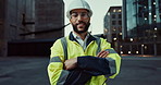 Face, engineering or happy man in city with arms crossed or smile for architecture or building. Construction site labor, night project and portrait of proud builder, confident worker and contractor