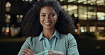 Business woman, city and smile at night in arms crossed for travel, commute and legal career or job. Excited face or portrait of young worker or African lawyer outdoor in confidence and bokeh lights