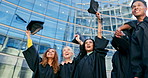 Education, graduation and success with student friends throwing caps together in celebration at ceremony. College, school or university with happy young group of graduate people outdoor on campus