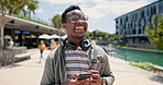 Phone, laugh and happy black man in a city walking, reading or checking silly social media meme. Travel, smartphone and African male person outdoor with funny, text or gif communication on commute