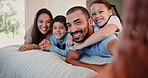 Face, happy family and selfie in home bedroom, love and bonding together with kids in the morning. Portrait, smile and parents take picture with children on bed for memory, relax and social media