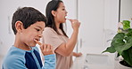 Mother, boy child and brushing teeth in bathroom, morning routine and dental care with toothpaste for fresh breathe. Health, self care with woman and kid bonding for oral hygiene at family home