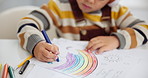 Children, drawing and crayons for art creativity or learning development in home as student, learn or rainbow. Kid, hand and coloring picture on paper for homework activity or lesson, skill or youth