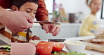 Father, son and cooking in kitchen for teaching with sandwich, butter and instructions with helping. Family, man and child with breakfast preparation in home with meat, vegetables and conversation