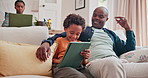 Dad, kid and learning with tablet on sofa for homeschool or online assessment and virtual education for courses. Parent, child and couch with touchscreen for digital literacy and growth development.