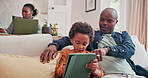 Dad, child and learning with tablet on sofa for homeschool or online assessment and virtual education for courses. Parent, kid and couch with touchscreen for digital literacy and growth development.