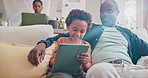 Happy father, tablet and black child in home for learning, education or scroll on internet with parents. African kid, dad and technology on sofa to relax or bonding together with family on lens flare