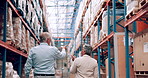 Logistics industry, warehouse and manager with talking for inspection, teamwork and planning for distribution. Shelf, stock and executive with collaboration for export, service or idea for shipping