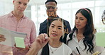 Business, planning and writing teamwork on glass board for brainstorming, mindmap or project management in office. Staff, manager and asian woman with goals strategy on wall with notes in workplace