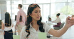 Woman, office and glass for brainstorming idea for presentation, thinking or planning for project and innovation. Female business employee, sticky notes and writing or working on strategy for company