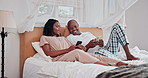 Couple, communication and happy in phone in bedroom for social media, online search or streaming in home. African man, woman and smile with smartphone for conversation, mobile app or relax in morning