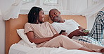 Couple, internet and laughing with phone in bedroom for social media meme, online joke or streaming in home. African man, woman or happy with smartphone for comic post, mobile app or relax in morning