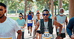 Exercise, marathon and man running with group on road outdoor for cardio, wellness or healthy body. Athlete, crowd and fitness in race competition, workout and training for sports at park in nature