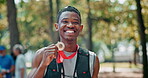 Black man, athlete and happy face with medal for winning or success, marathon and long distance running. Sportsman, achievement and victory for track outdoors, pride and fitness for sprinting race