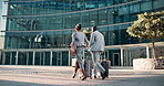 Back of people, walking or commute in city to work or office in conversation or outdoor discussion. Travel, employees and networking in urban area, Cape Town or business with luggage, man and woman