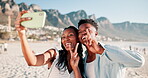 Couple, phone and man with black woman in vacation for selfie, love and together with peace. Partners, smile and laugh outdoor in beach of Cape Town for holiday, date and happy to relax in summer