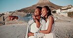 Couple, hug and love on beach with travel, holiday or vacation for bonding, date or valentines day in sunset. Young african woman and man in summer, sightseeing and excited in Cape Town, South Africa