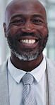 Smile, business and face of black man in office for confidence, positive attitude and happiness. Vertical, professional and portrait of male person for executive, boss of manager of corporate company