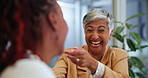 Office, senior and CEO laughing at joke by funny employee in creative company for meeting in business. People, happiness and joy for woman, comic and smile on face for comedy from staff in workplace